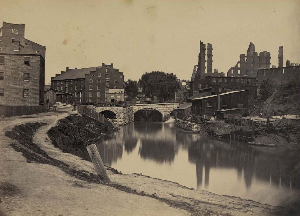 Ruins at Richmond, Va., canal in foreground, ruins in background, 1865