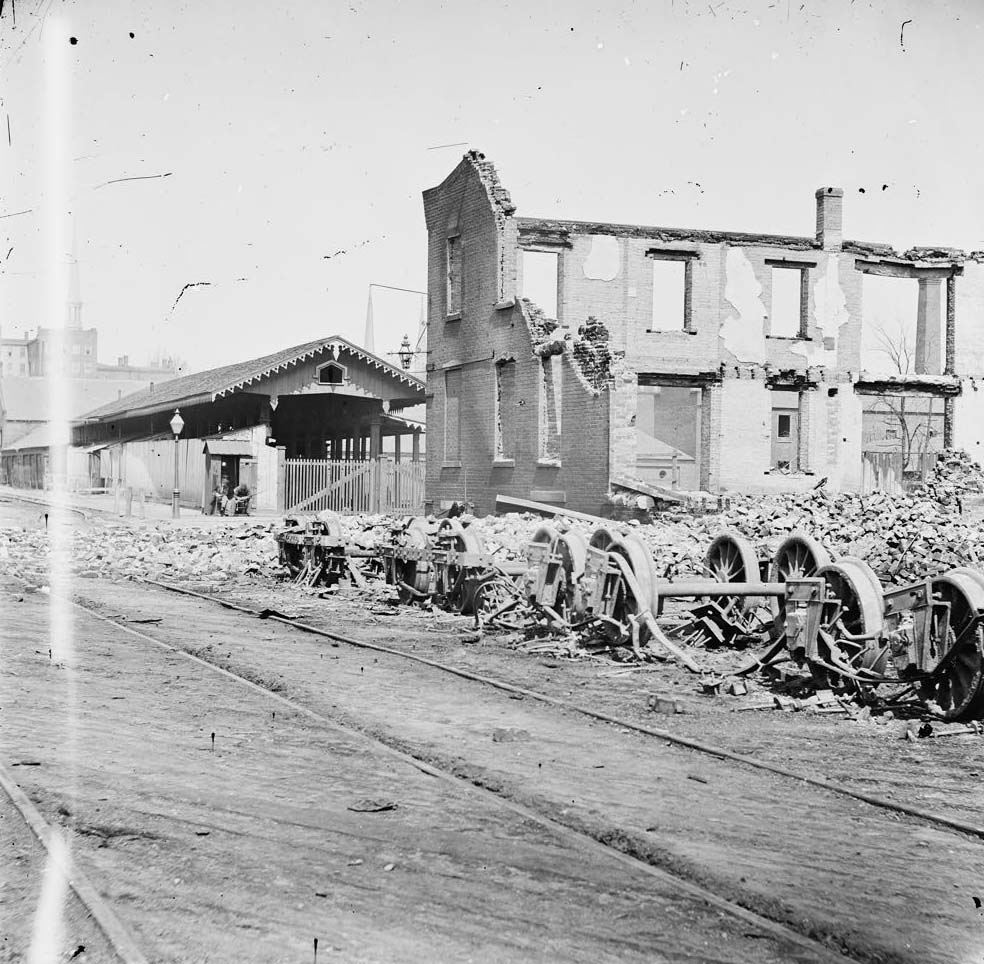 Wheels and burned railroad cars near Richmond & Petersburg Railroad station, 1865