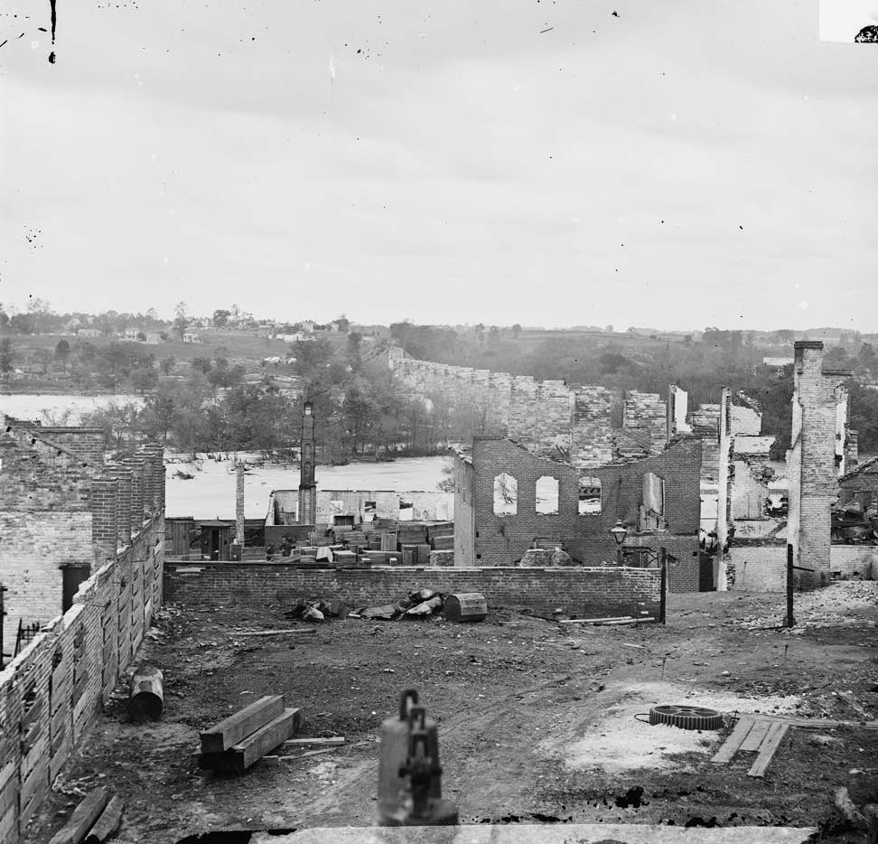 Ruins of Richmond & Petersburg Railroad bridge; south bank of the James beyond, 1865