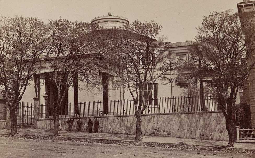 Four soldiers in front of the Monumental Church at 1224 E. Broad Street in Richmond, 1865