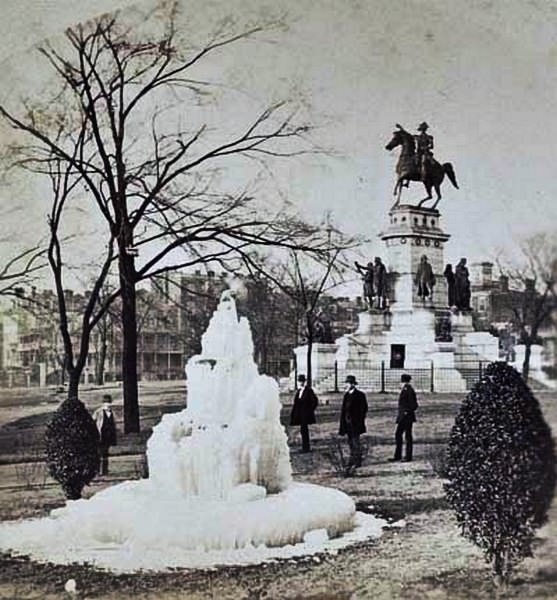 A group standing around a frozen fountain in Capitol Square, near the Washington Monument in Richmond, Virginia, 1860