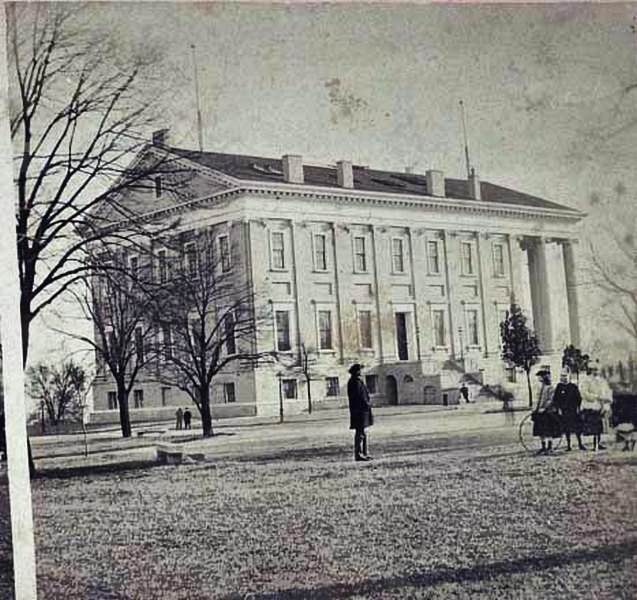 A group in front of the Virginia State Capitol in Richmond, Virginia, 1865