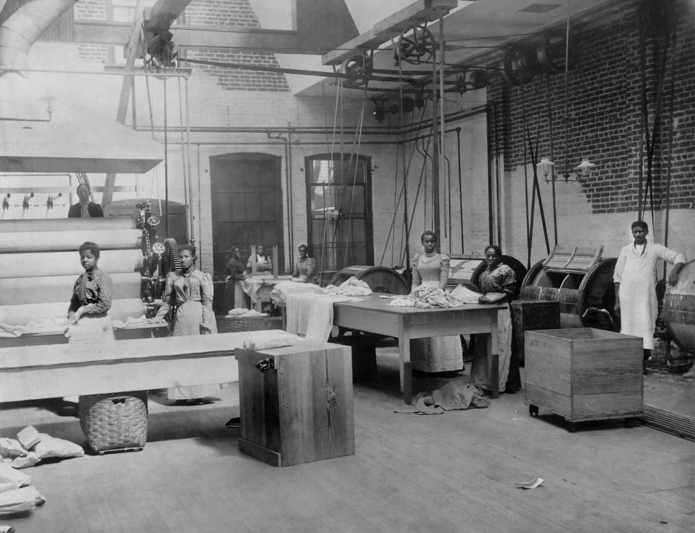 African American Women and Men near Machinery at Lexington Laundry, Richmond, 1900