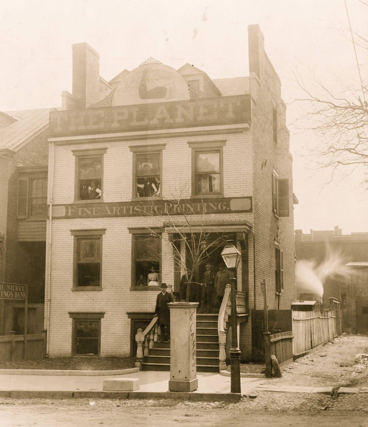 People posed on porch of and in the Planet newspaper publishing house, Richmond, Virginia, 1900