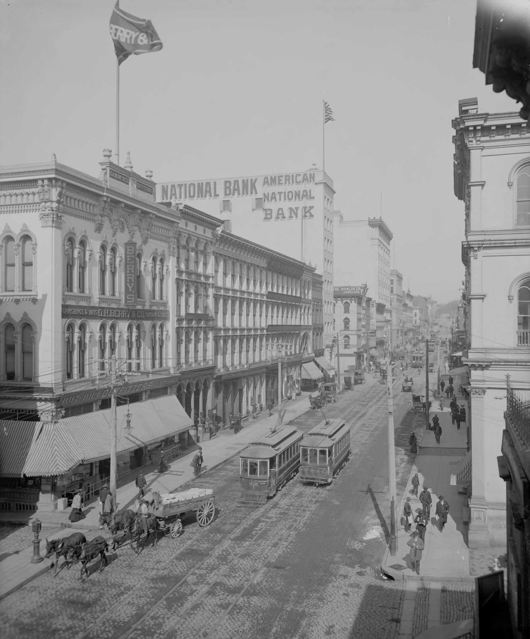 Main Street in Richmond, Virginia before the age of Bank Bailouts. Public Transportation Dominates the street with very little vehicular traffic besides. Many of the Buildings are cast iron, 1900