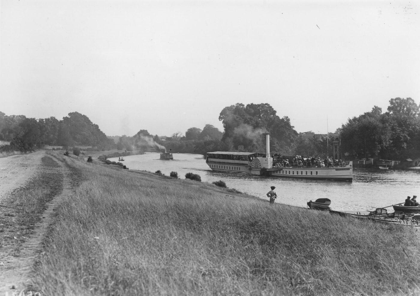 The pleasure steamer, the 'Queen Elizabeth', coming up the River Thames from Kingston Bridge to Hampton Court, seen from the towpath, 1907