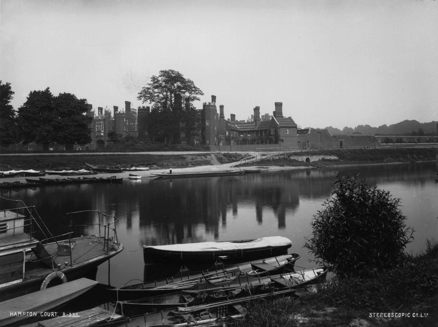 Boats moored on the River Thames at Hampton Court Palace, 1900