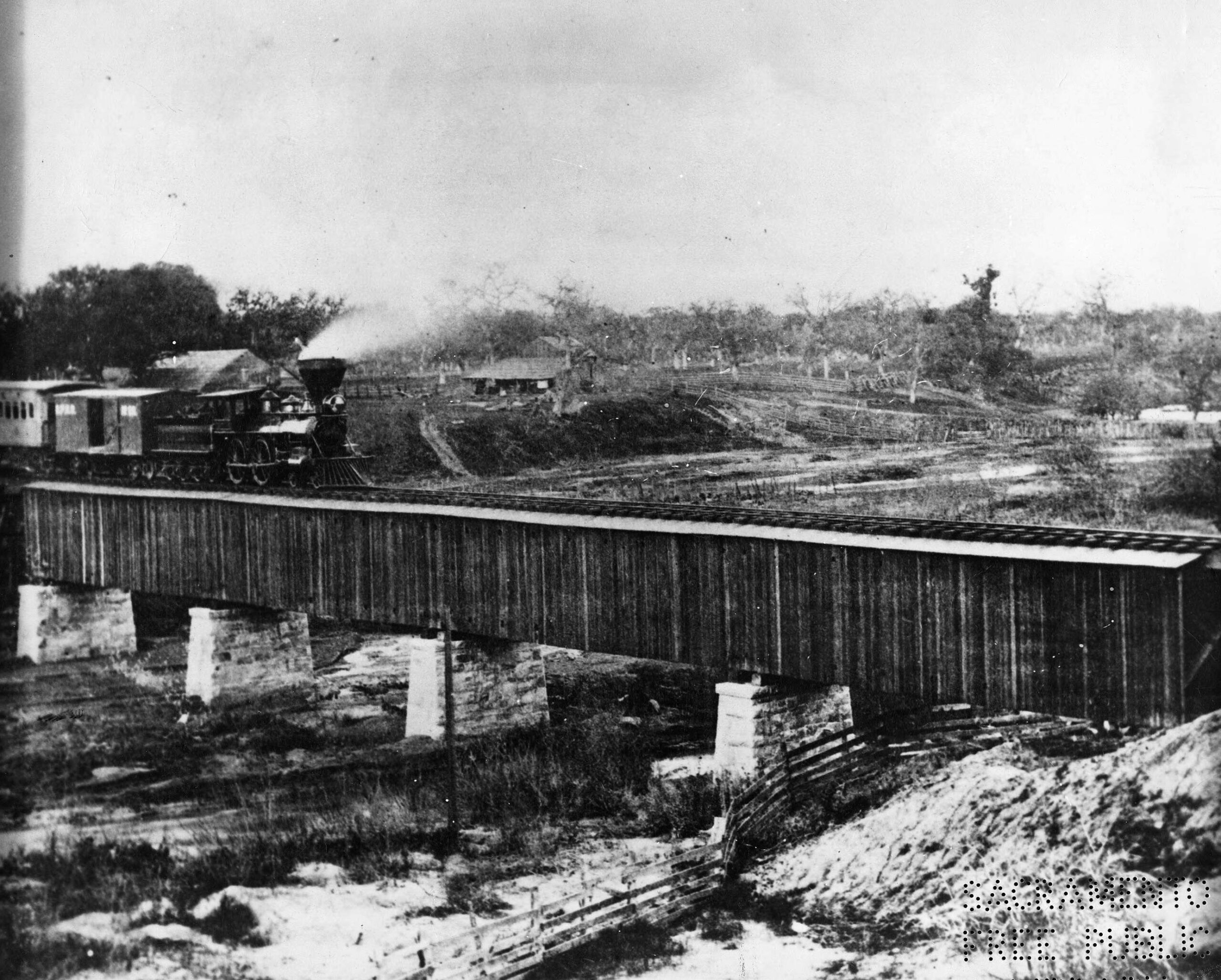 A Central Pacific Railroad train of the Dry Creek Bridge, located 17 miles east of Sacramento, 1865