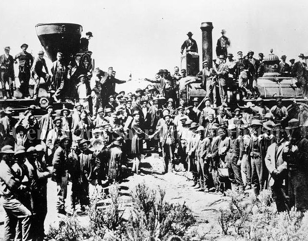 Crowd and engines gathered for Transcontinental Railroad Golden Spike completion ceremony, 1869