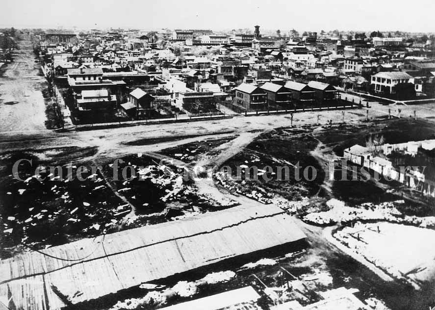 Elevated view of Sacramento taken from the dome of the capitol during its construction looking northeast over the city, 1868