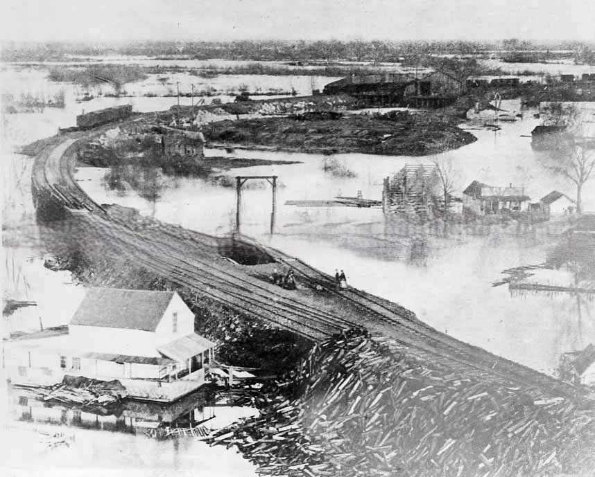 An elevated view of Sacramento during the great flood of 1862. This view shows "China Slough" and the railroad construction project along I Street
