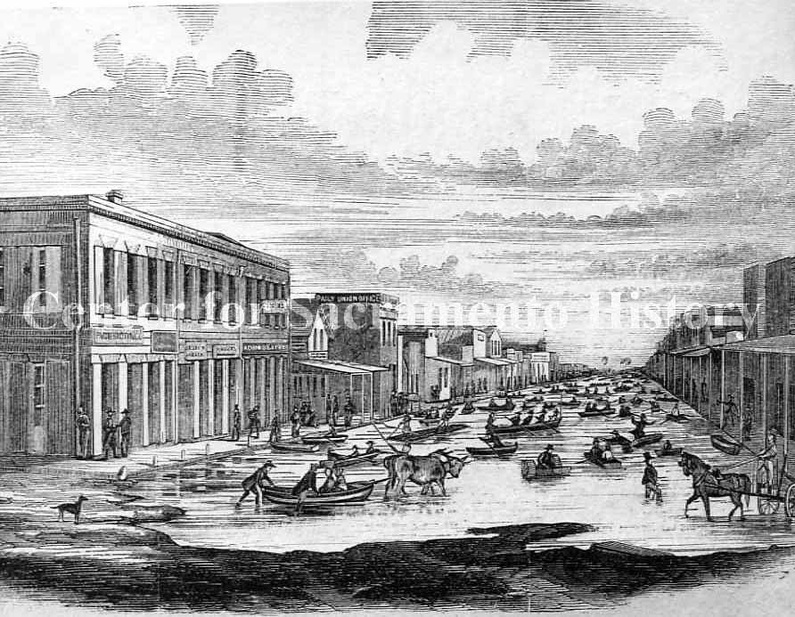 Flood of 1862 in Sacramento. This view shows J Street from Front Street looking east.