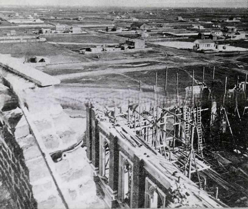 View of Sacramento from atop of the California State Capitol building under construction, 1868