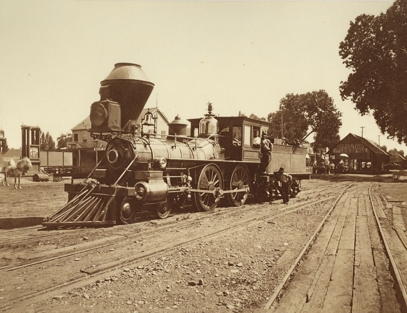 Locomotive No. 162 on tracks at foot of U Street in Sacramento, 1869
