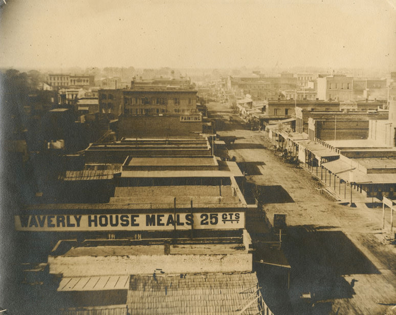 View of K Street looking west from 6th Street in Sacramento, 1868