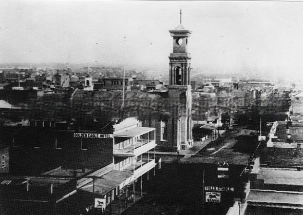 Street scenes of businesses on K Street from 7th Street looking east in 1869. The Golden Eagle Hotel is on the left and St. Rose of Lima Church is across 7th Street further on the left.