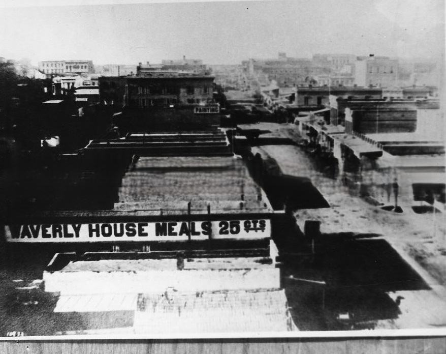 Street scenes of businesses on K Street from 5th Street looking west in 1868.