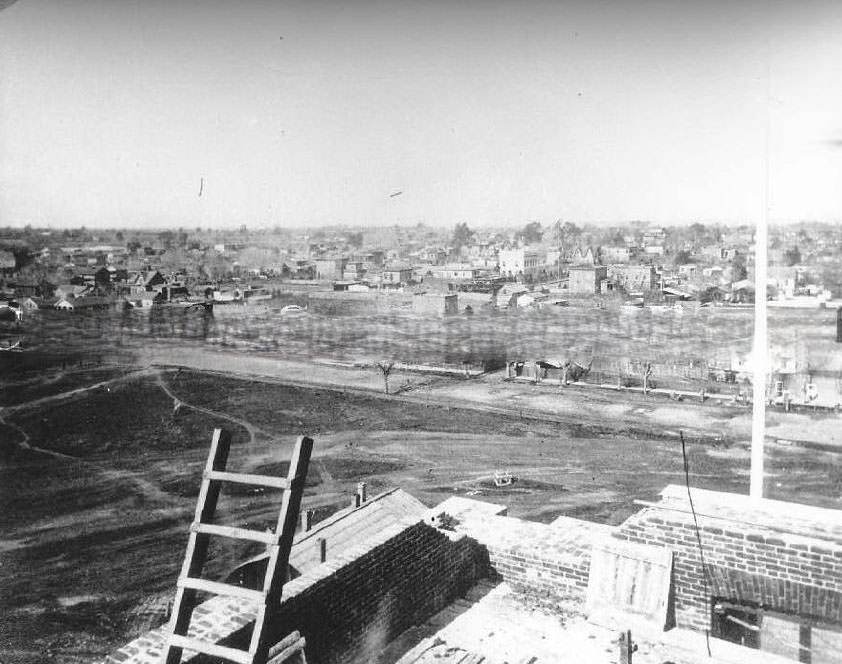 Sacramento from the top of the incomplete California State Capitol building while construction, 1867