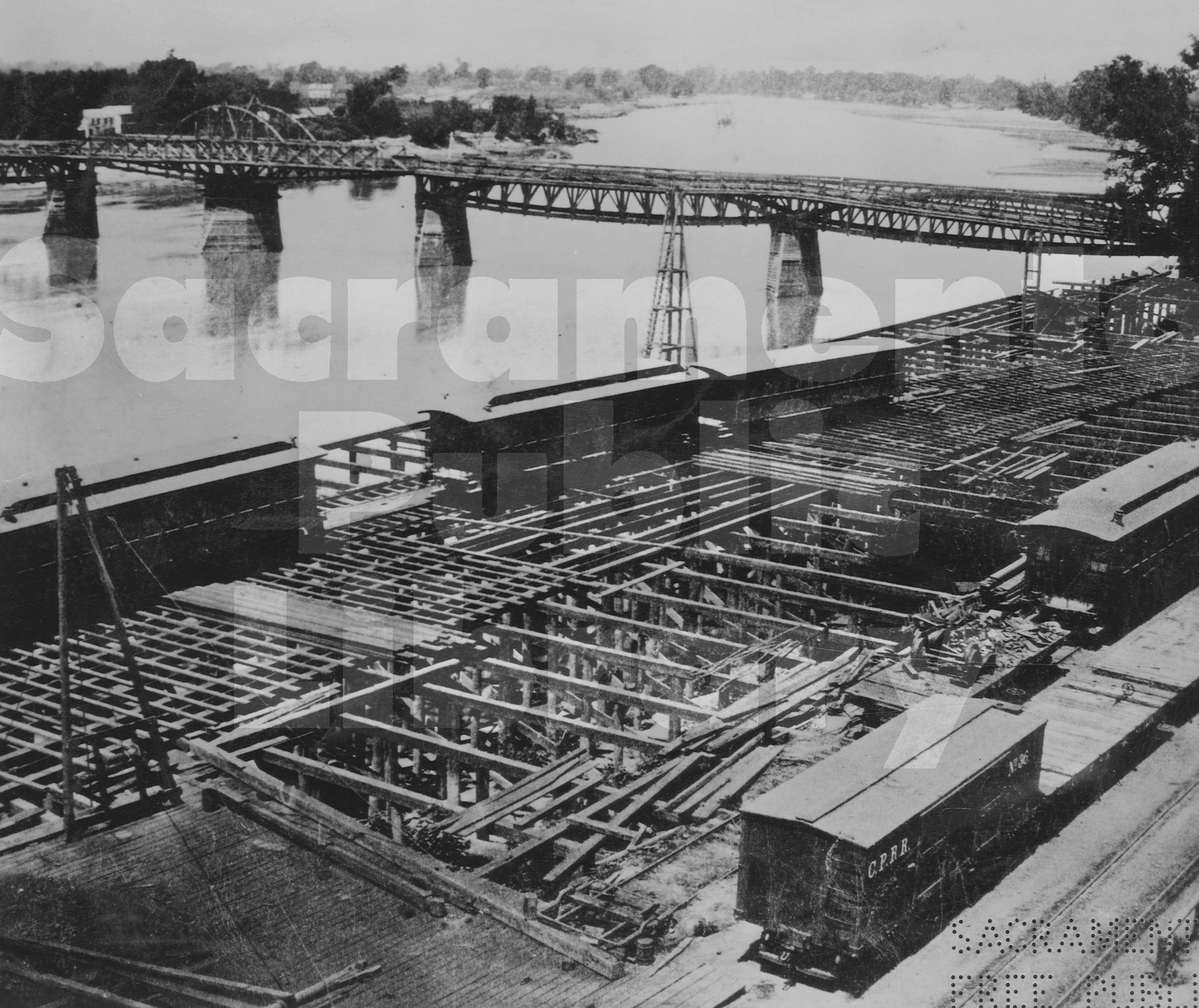 Construction of the Sacramento River waterfront near I Street, 1864.