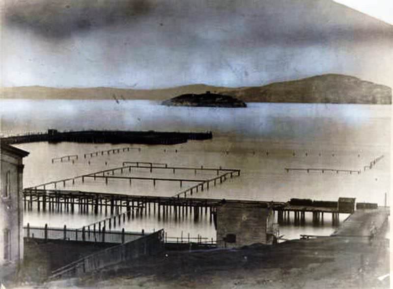 View of Meigg's Wharf with Alcatraz Island in background, 1856