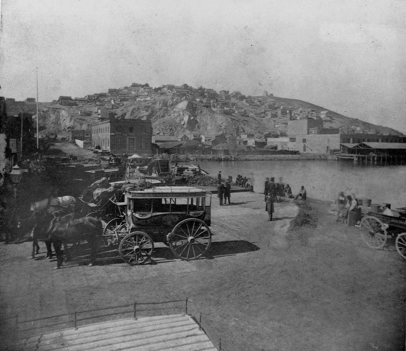 Few houses dot the face of Telegraph Hill above the wharf in San Francisco, 1850s