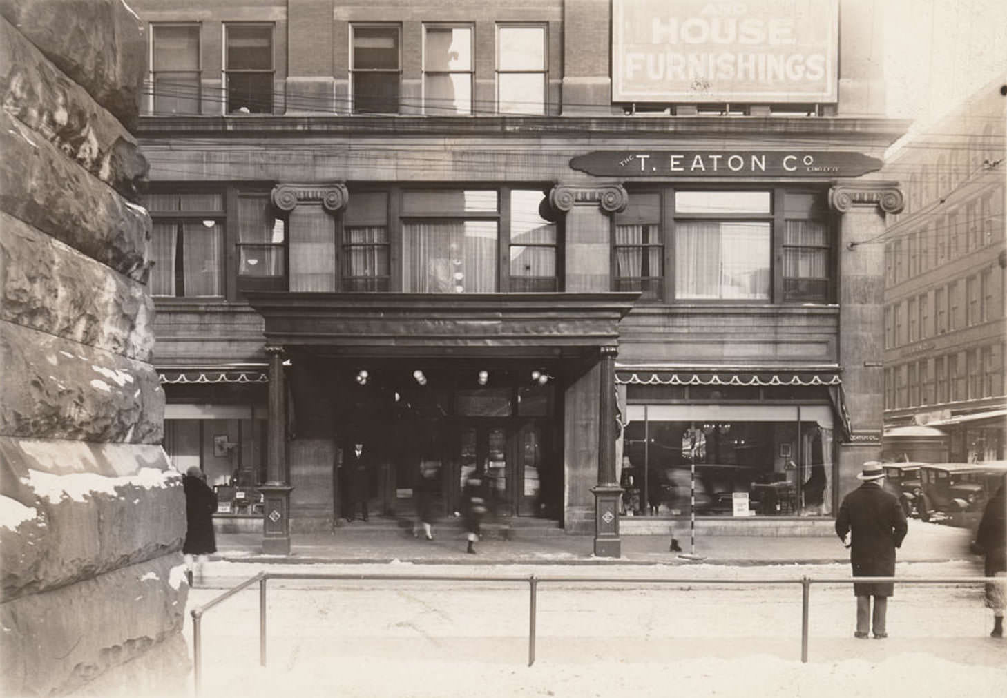 Looking east across James St. to Eaton's Queen St. department store from the front lawn of Old City Hall, 1930