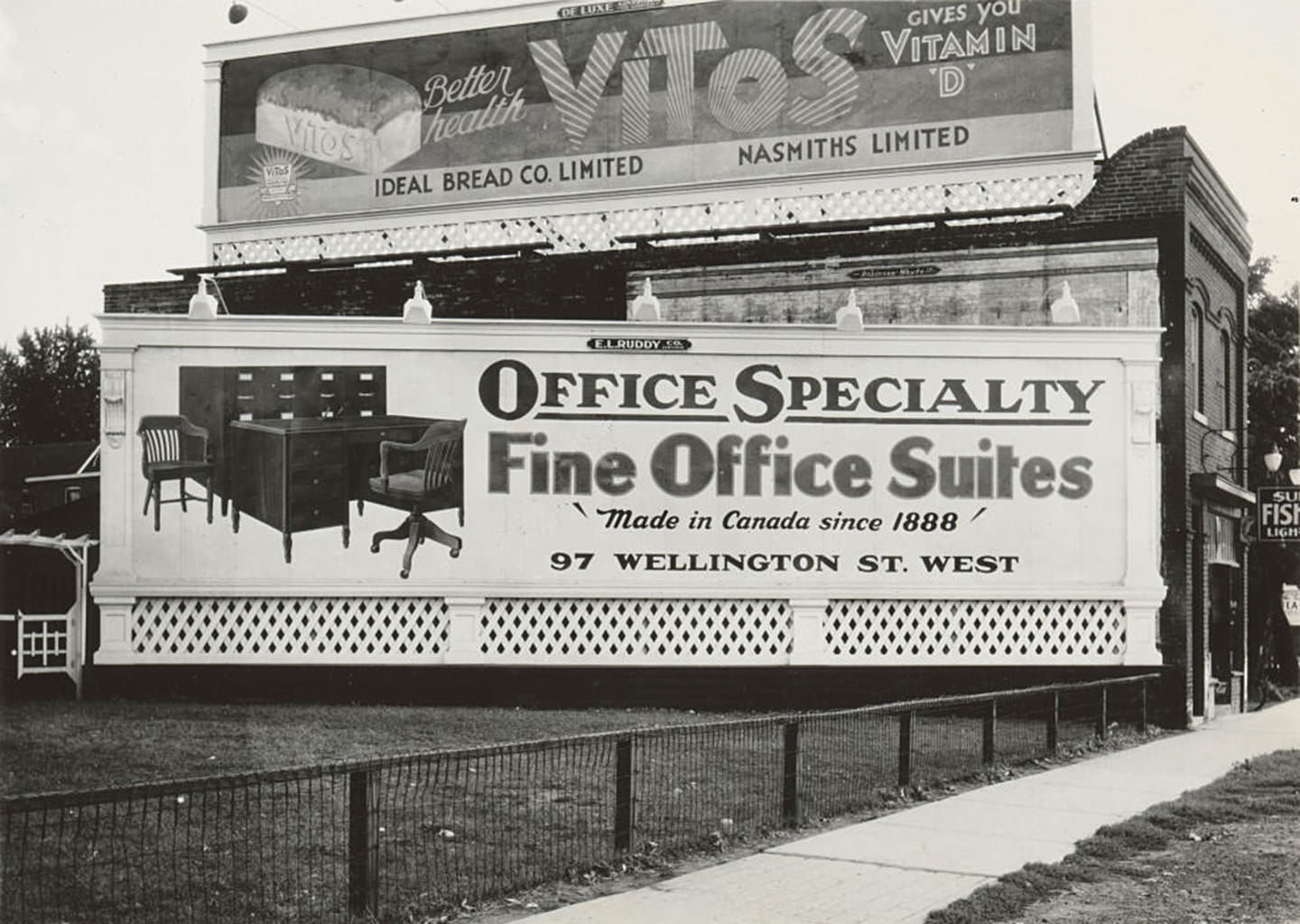 A closeup view looking south of new billboards placed on top of and beside Superior Fish & Chips, 1887 Yonge Street, 1935