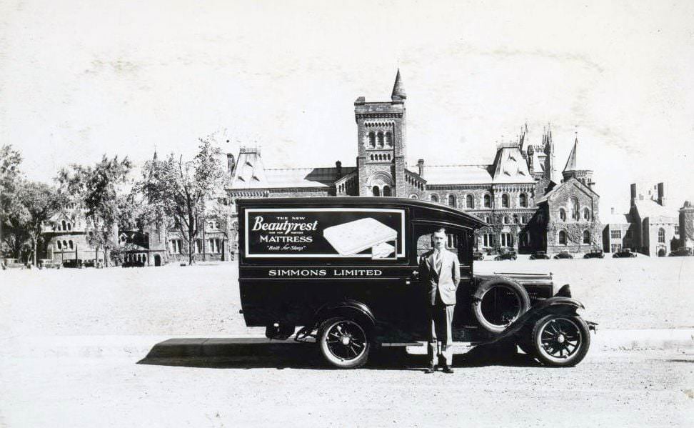 Simmons Limited Beauty Rest Mattress delivery vehicle in front of University College, 1930