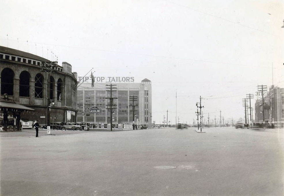 Lake Shore Road and Bathurst Street. Visible in the image is Tip Top Tailors and Maple Leaf Stadium, on the left, and Rogers-Majestic on the right, 1930