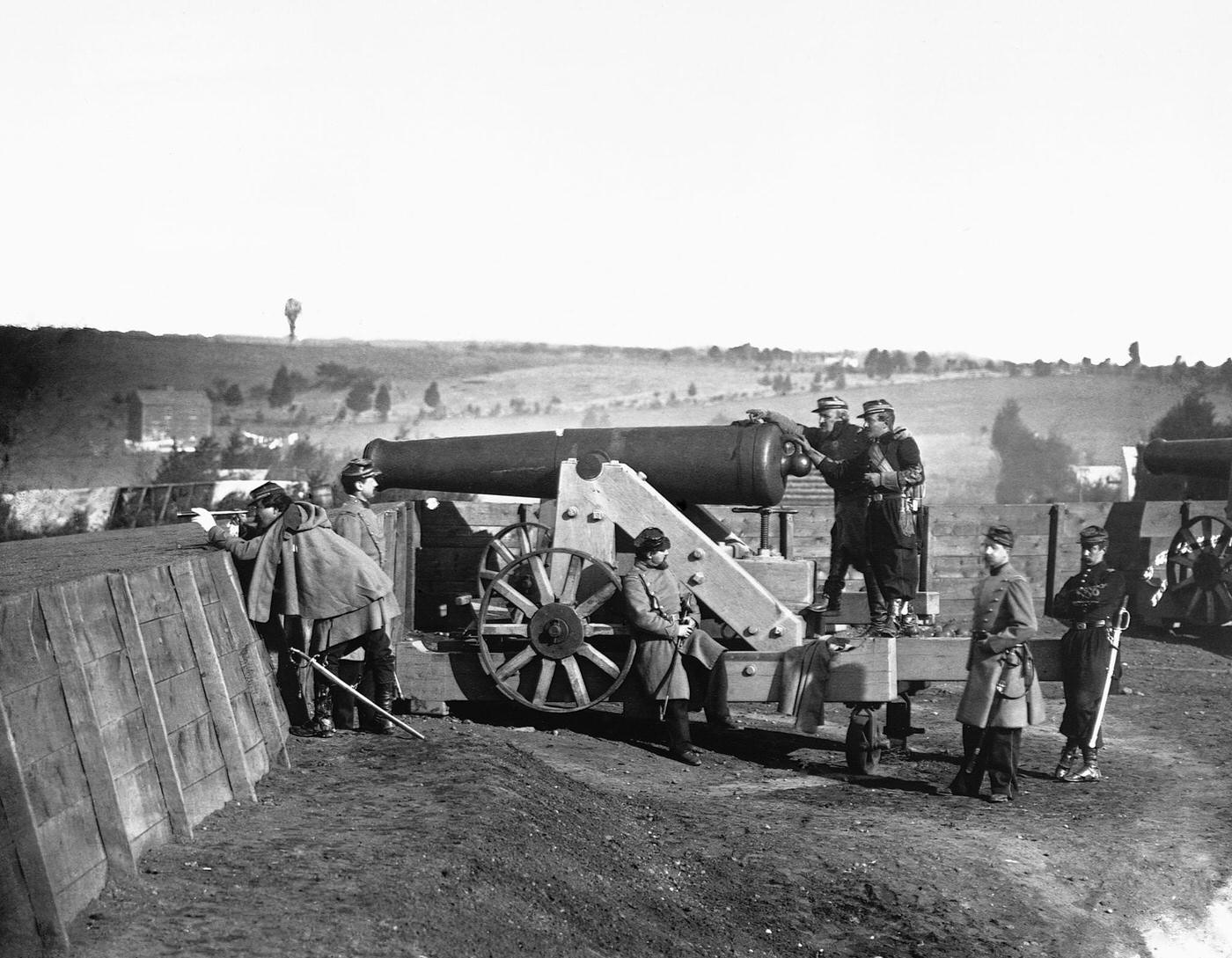 Officers of the Fifty-fifth Infantry inspecting cannons at Fort Gaines, near Tenley, D.C., 1861