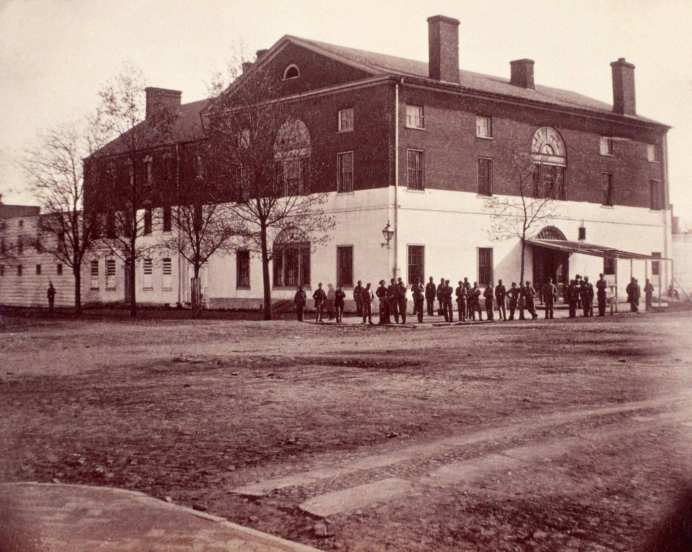 Union soldiers pose outside the Old Capitol Prison in Washington, D.C. During the American Civil War the prison was used to incarcerate political prisoners and prisoners of war.