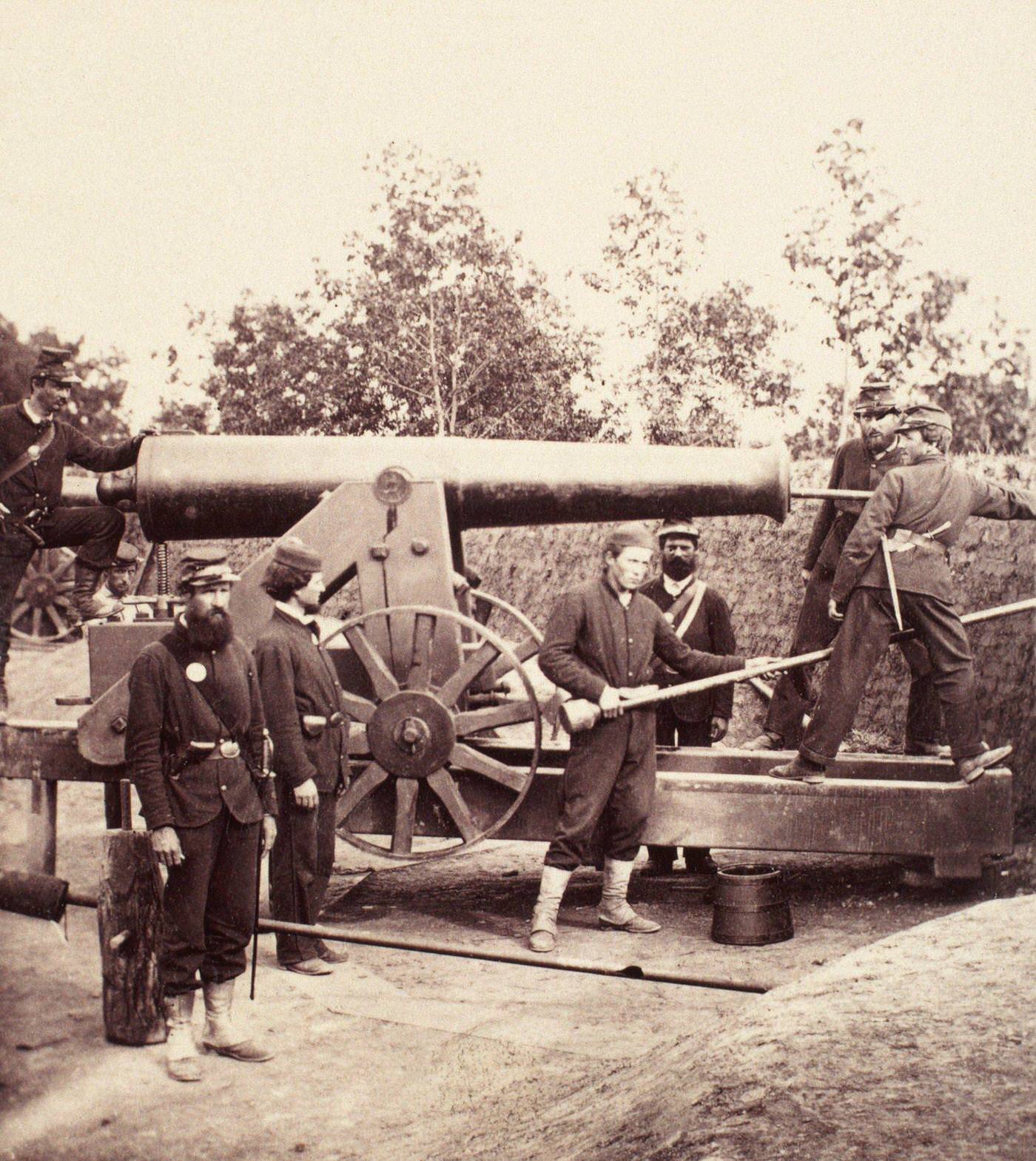 Union gunners pose around a 32-pounder seacoast gun mounted at one of the many forts that protected Washington, D.C., 1860s