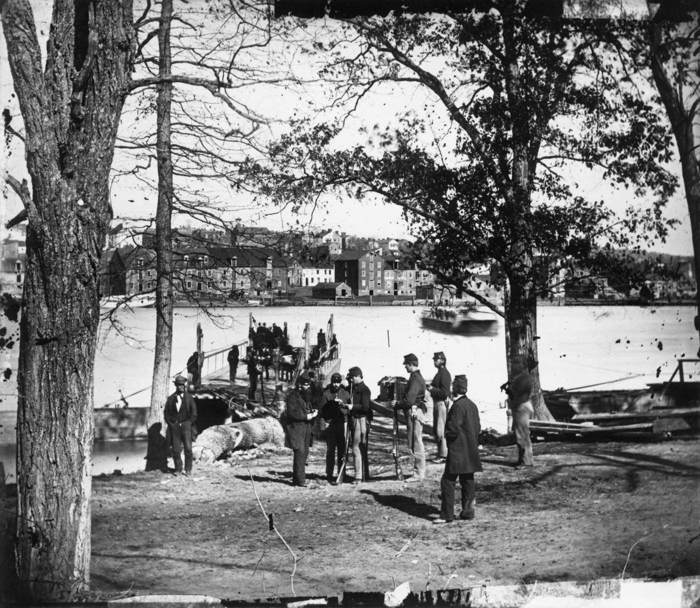 Union Army sentries standing guard at the ferry which connects Georgetown in the District of Columbia with Virginia across the Potomac River, 1861