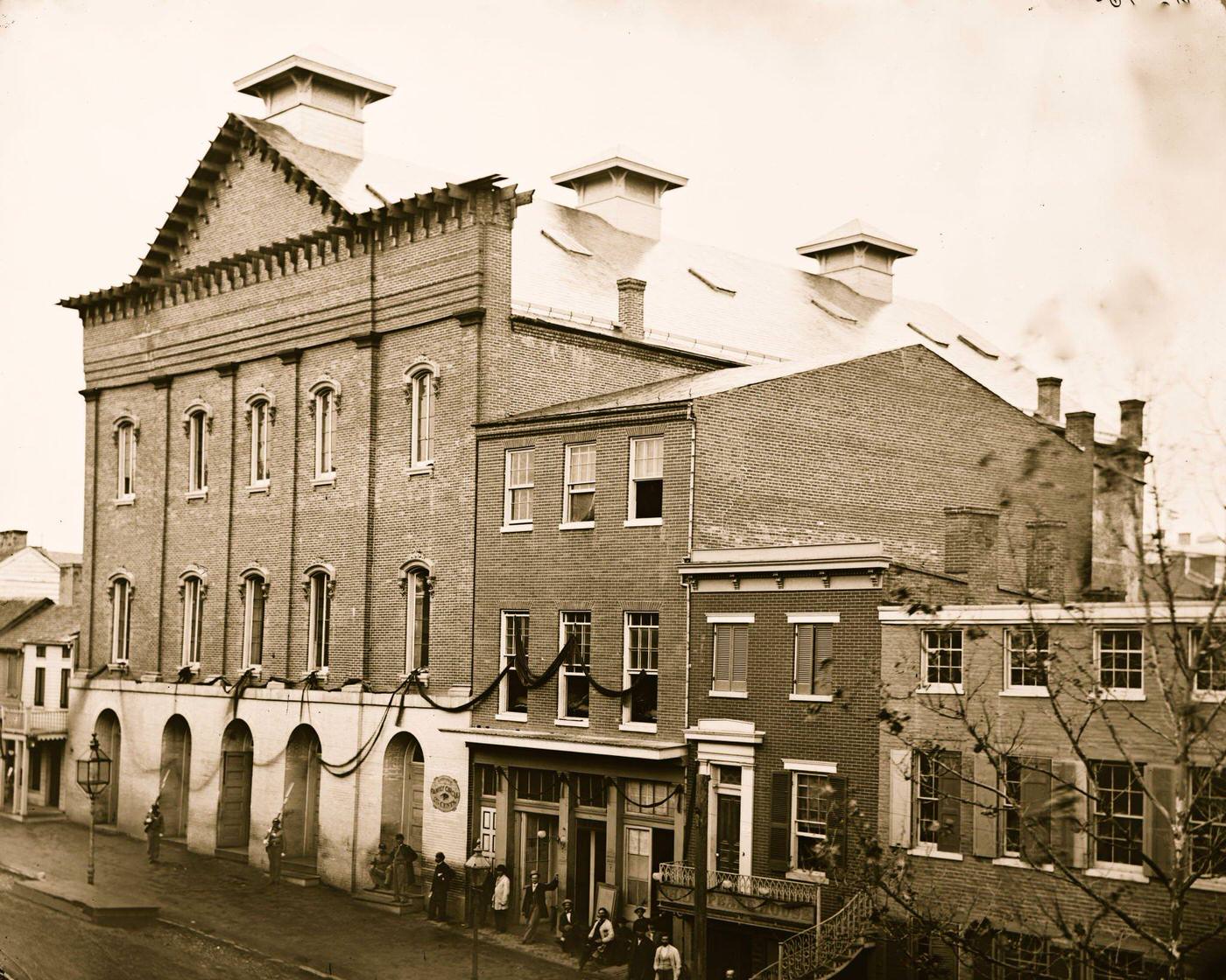 Ford's Theater with guards posted at entrance and crepe draped from windows, Washington, D.C., 1865