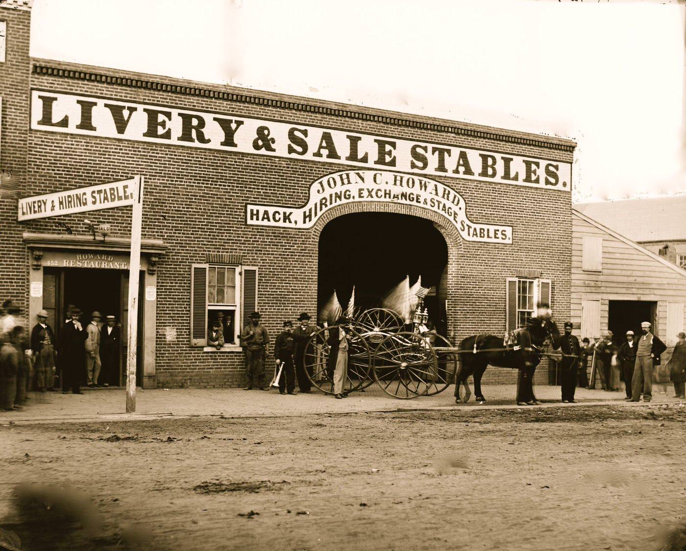 John C. Howard's stable on G Street between 6th and 7th, 1865