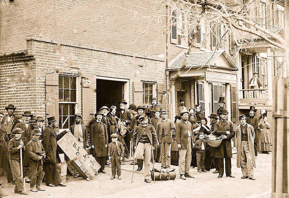 Maimed soldiers and others before office of U.S. Christian Commission Protestant Organization founded by the YMCA to provide religious and social services to Union Troops; Founded in 1861 in New York after the First Battle of Bull Run