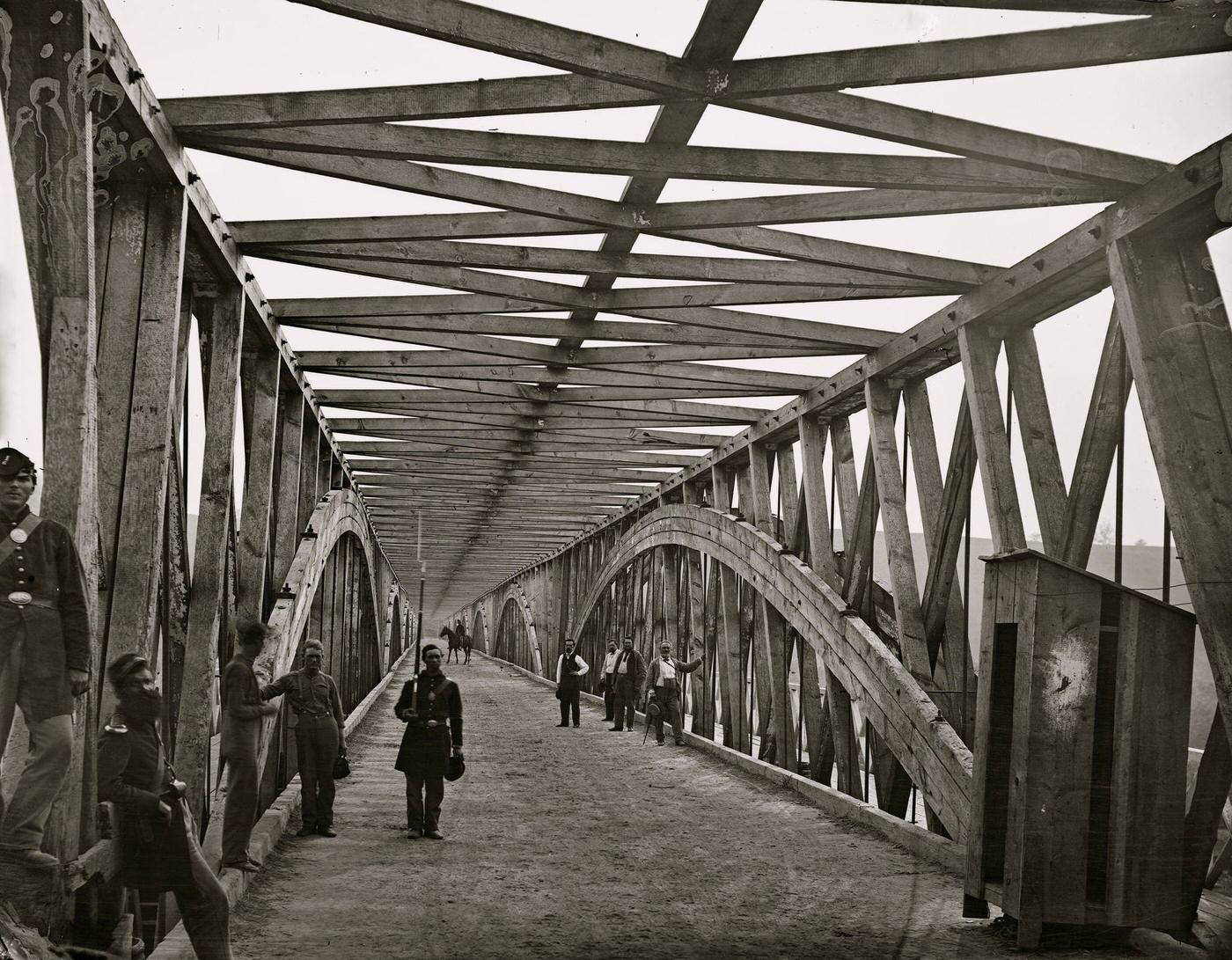 The Chain Bridge over the Potomac, with soldiers and guardhouse visible, Washington, D.C., 1865