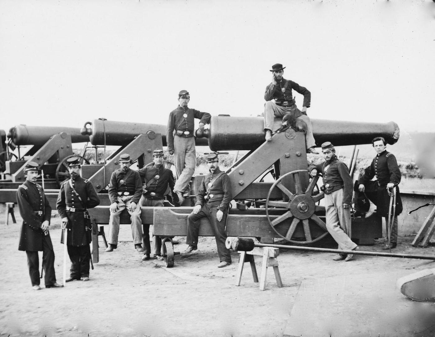 Officers and men of the 3rd Regiment Massachusetts Heavy Artillery stand next to their Columbiad guns, Fort Totten, Washington, D.C., 1865
