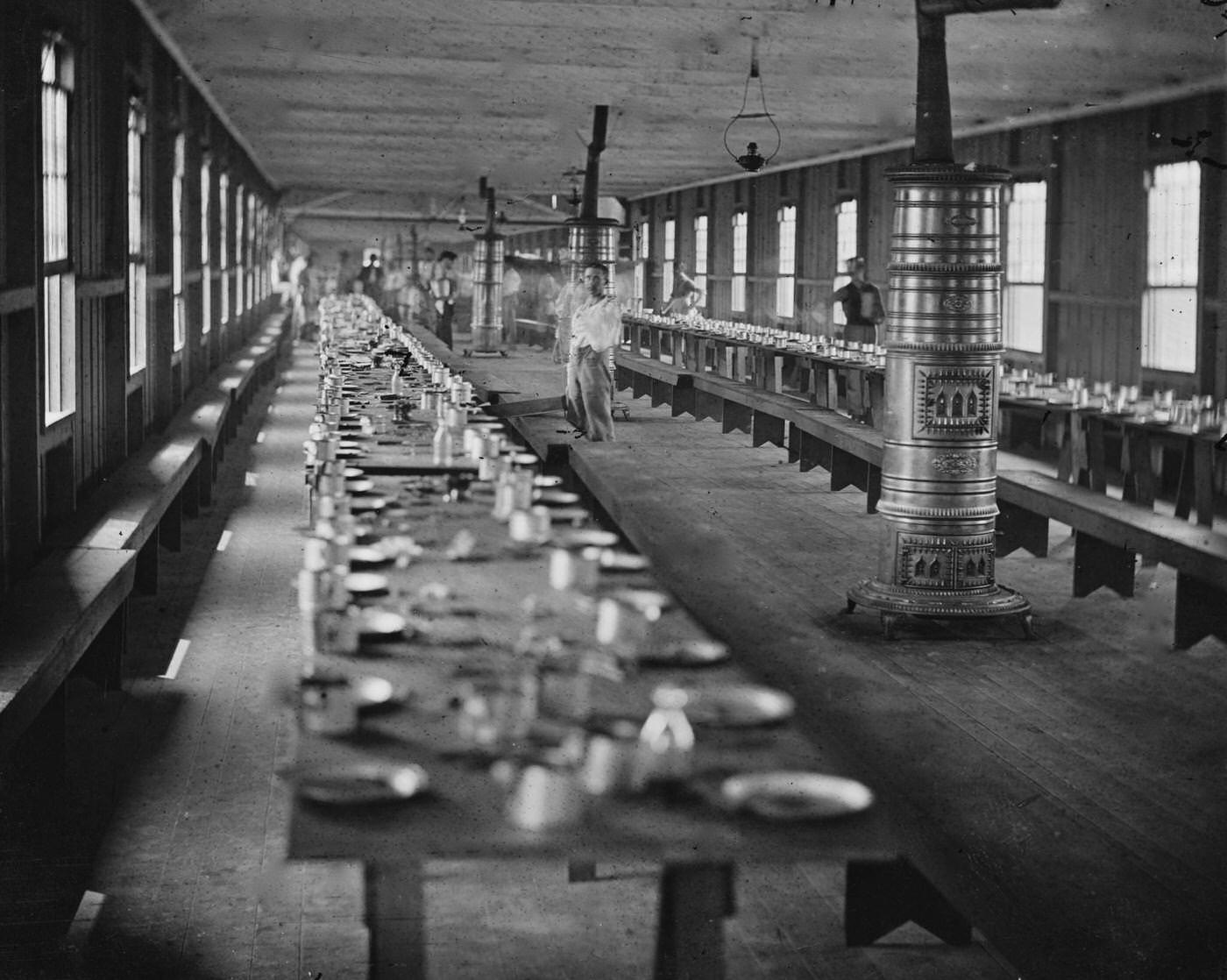 Interior view showing the mess hall at Harewood Hospital, heated by elaborate stoves, Washington, D.C., 1865