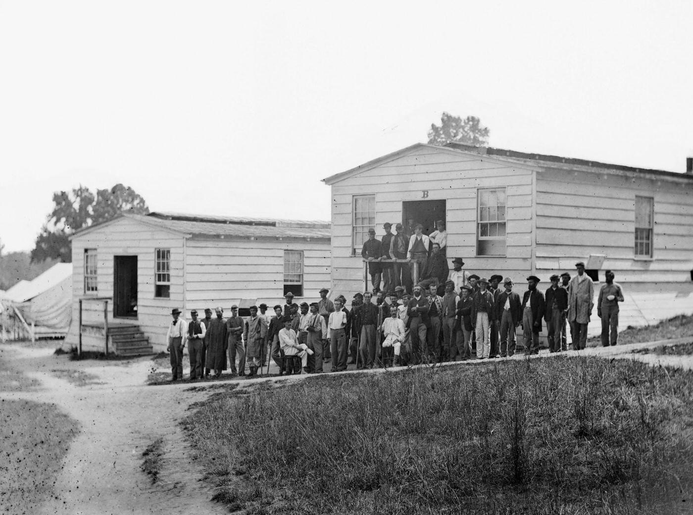 Group of patients in front of ward B of Harewood Hospital, near Wasington, DC, 1863.