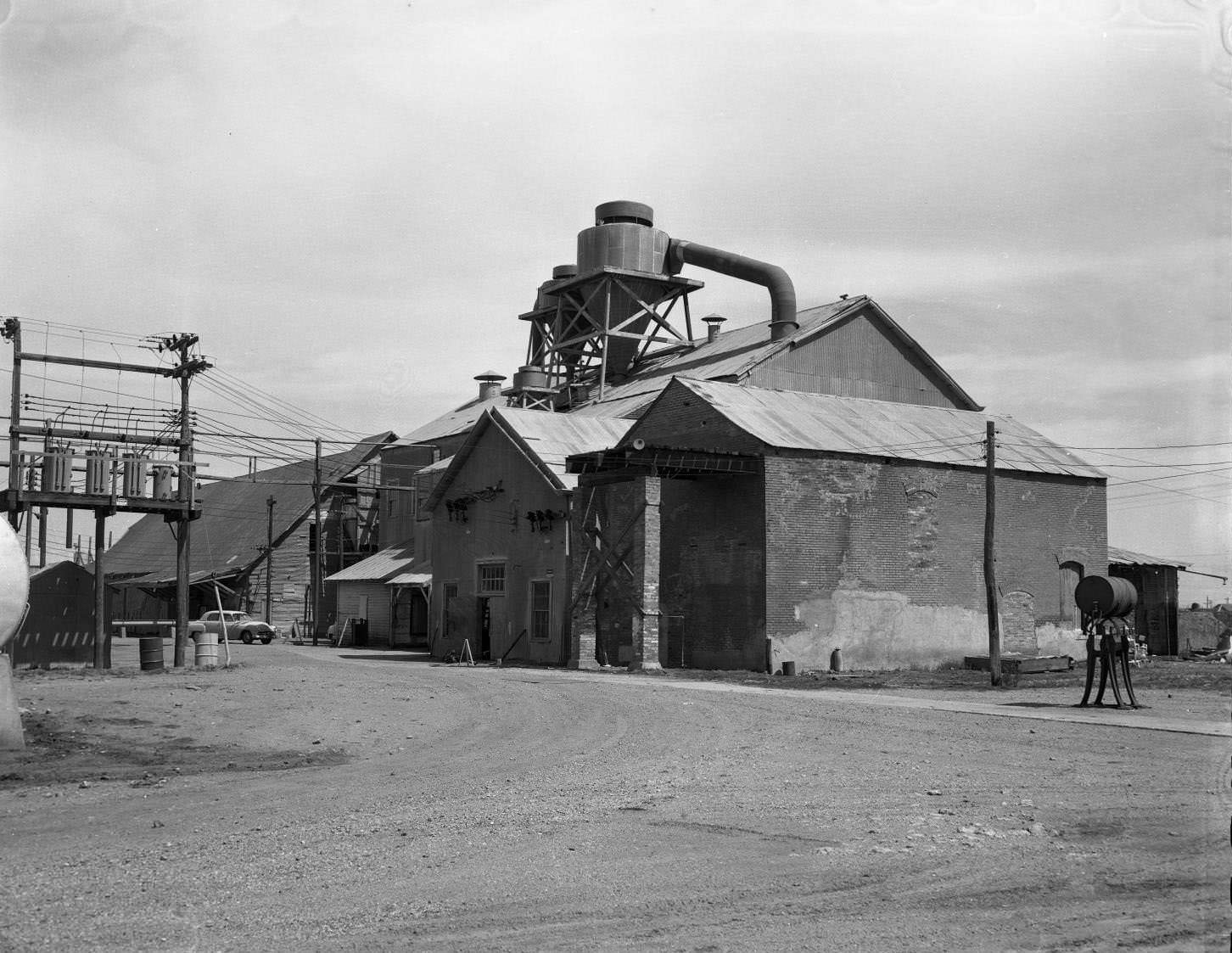 A building exterior that seems to be a cotton factory, 1958