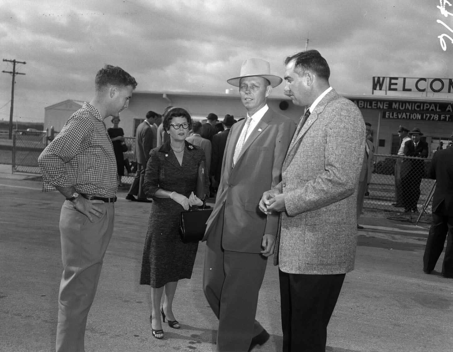 Several people at the Abilene Municipal Airport, 1956
