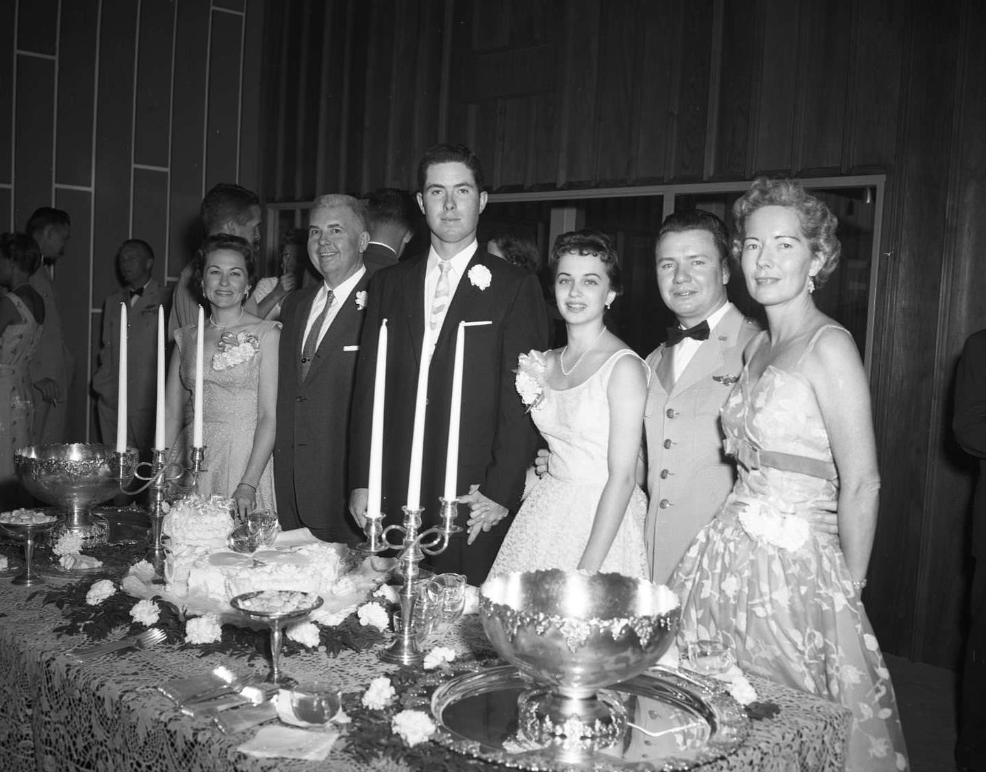 Pete Olds and Louis A. Rochez alongside other people at a banquet at the Dyess Air Force Base, 1954