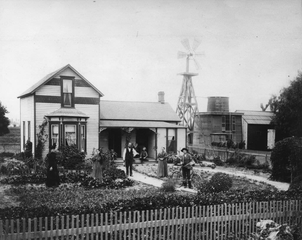 Residence of the John Fredrick Hein family, located at the southwest corner of County Road (now Lincoln Ave.) and Brookhurst Street (possible 925 West Lincoln Ave.), Anaheim, 1896