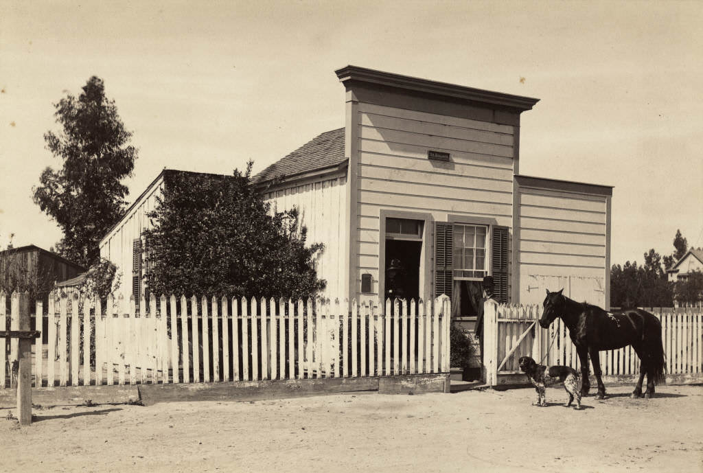 Doctor James Hovey Bullard standing outside his first doctor's office on Los Angeles Street (now Anaheim Blvd.), 1885