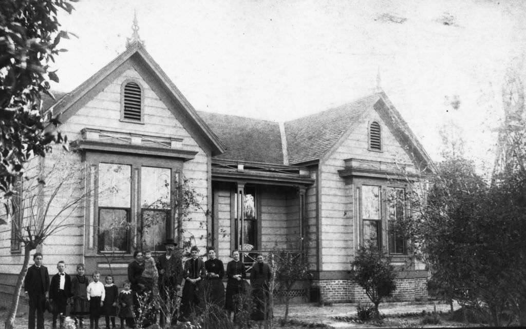 Timm Boege family standing in front of their residence, located at 1006 West Center Street (now Lincoln Ave.), Anaheim, 1887