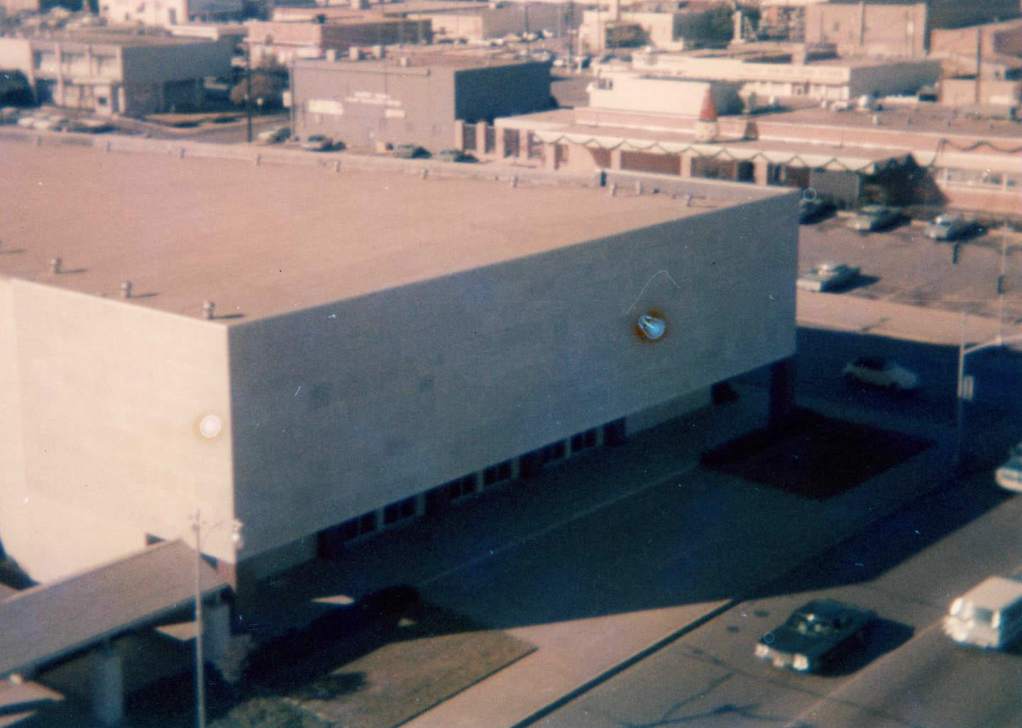 Downtown Arlington, 1973. The First Baptist Church. There are other buildings, cars, and streets.