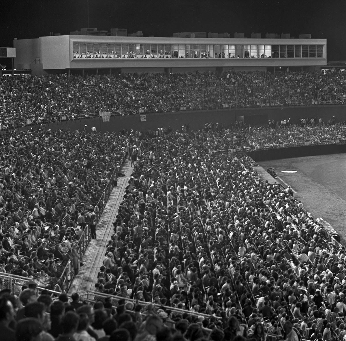 View of the crowd at Arlington Stadium for the Texas Rangers baseball team's first home game in Arlington, 1972