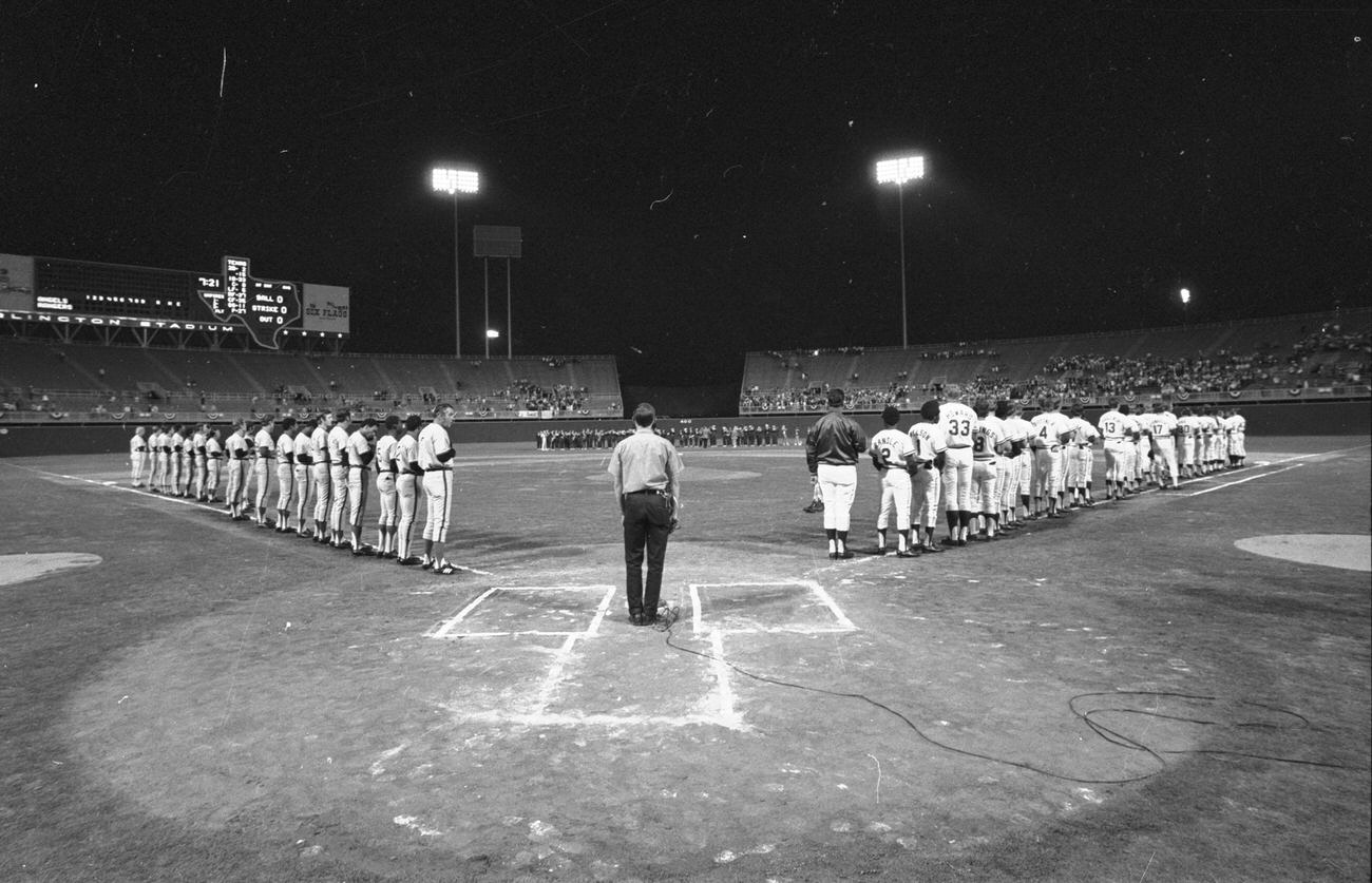 Texas Rangers opening night at Arlington Stadium; Rangers vs. California Angels; players lined up for national anthem, 1972