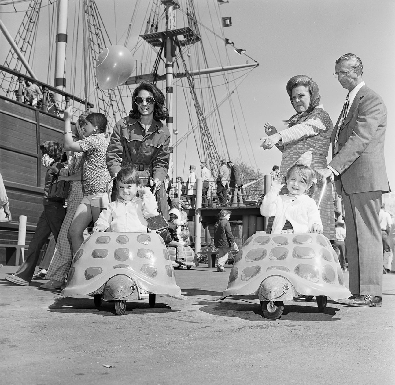 Visitors to Seven Seas, children riding in turtle cars, Arlington, Texas, 1972